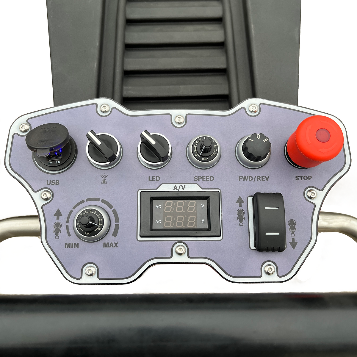 Control panel with various buttons and a digital display on a gray background